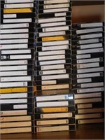 Shelf of VHS, various titles, recorded: includes