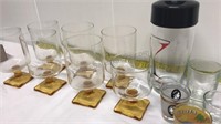 Shaker, cocktail glasses and shot glasses