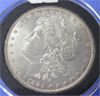 1884 O BRILLIANT UNCIRCULATED MORGAN DOLLAR