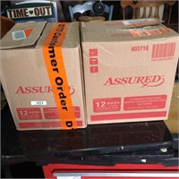 Boxes of Assured maxi pads (2)