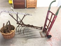 old plow, feed store dolly & shovel heads