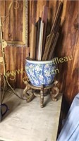 Oriental planter on stand full of wooden trim