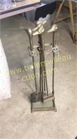 Brass fireplace set with duck heads
