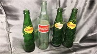 4 soda bottles squirt and Coca-Cola