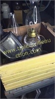 Yellow crate with oil lamp parts and lantern