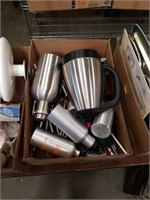 Box of water bottles and ginsu knives