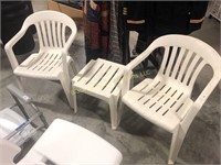 Two Plastic Patio Chairs with Small Table