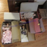 5 porcelain dolls in boxes