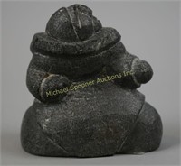 INUIT STONE CARVING OF A MAN LOOKING SKYWARD