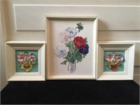 Group of three floral pieces. Larger one at