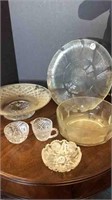 ASSORTMENT OF GLASS PLATTERS + BOWLS + CREAM AND