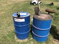 Two 55Gal Hydraulic Fluid Drum & Pump Some Fluid