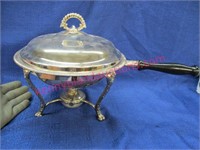 old covered casserole on stand with burner