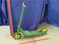 antique green metal scooter