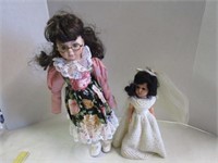 Beautiful porcelain doll on stand & bride doll