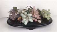 Gemstone grapes on black lacquer base