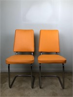 Pair of vintage orange vinyl chairs