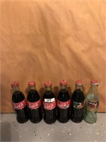 Lot of 6 Christmas Coca Cola glass bottles