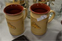 Signed pottery fish mugs