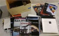 Boxful of car brochures