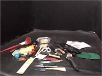Variety of kitchen gadgets and several knives
