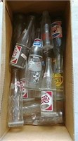 Boxful of soda bottles including Pepsi