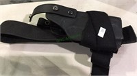 Black hard plastic gun holster with Velcro strap,