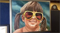 Framed oil painting on canvas of a little girl