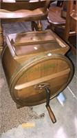 Antique butter churn that’s been refinished all