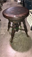 Antique piano stool with ball and claw feet, with