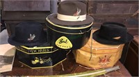 Three vintage men’s hats with the hat boxes,