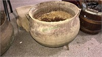 Cast-iron pot with two handles and holes are