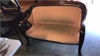 Antique mahogany empire settee with claw feet,