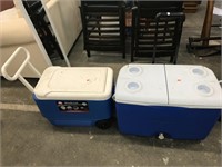 Two used coolers on wheels