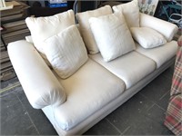 Nice large white sofa with throw pillows

Few