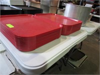 Twenty Four Red Plastic Trays