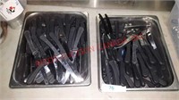 Pair of insert trays full of steak knives