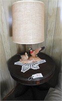 Mahogany drum table and ceramic duck lamp