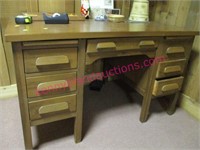 old wooden 7-drawer desk