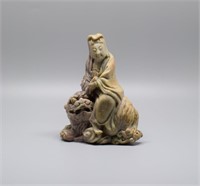 Chinese Qing carved soapstone Guanyin ridding on