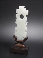 Chinese carved jade plaque raised on a rosewood