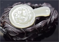 Chinese carved white jade hand mirror with a
