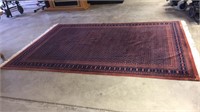 Oriental carpet 6' 3" x 9'  small tear in corner