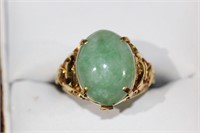 22ct jade dress ring, set with a 6.50cts oval