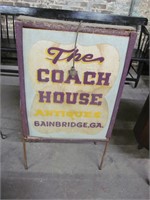 The Coach House Antiques sign, on legs
