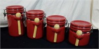 Bright red set of 4 canisters with spoons