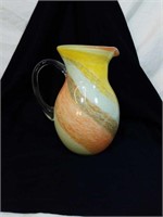 Beautiful art glass pitcher approx 9