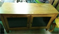 Wooden TV stand with glass doors