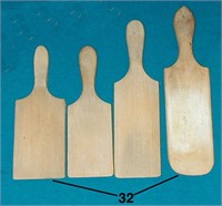 4 wooden paddle-like objects, likely for kitchen