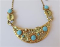 Designer gold tone blue stone set necklace